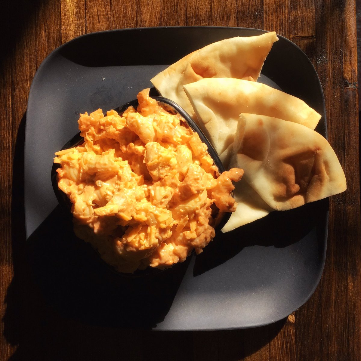 Today's special at our @crossroadsmarketyyc location is butter chicken mac &amp; cheese with naan bread.