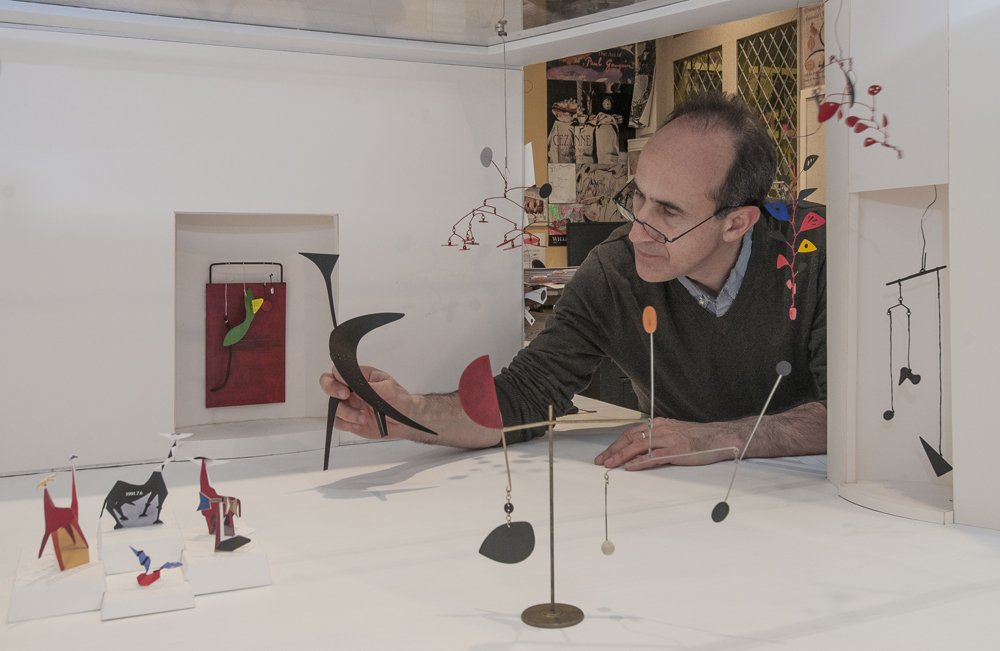 ngadc's tweet image. Curator Harry Cooper tinkers with the layout of a brand new East Building installation. #futureMW #behindthescenes