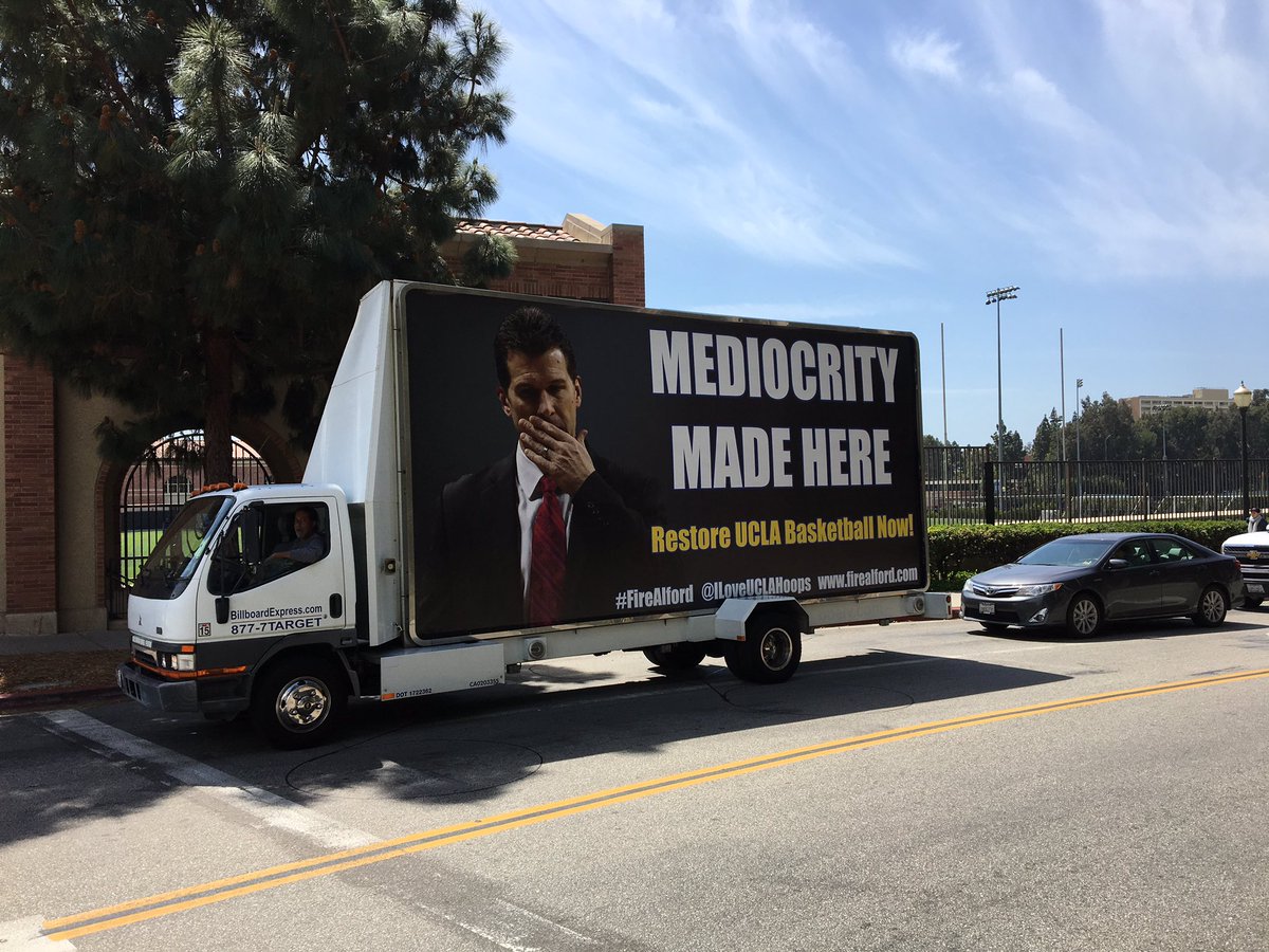 Square bus going around #UCLA reading 'Wake Up Dan' on one side, 'Mediocrity Made Here' on the other. #UCLAbball