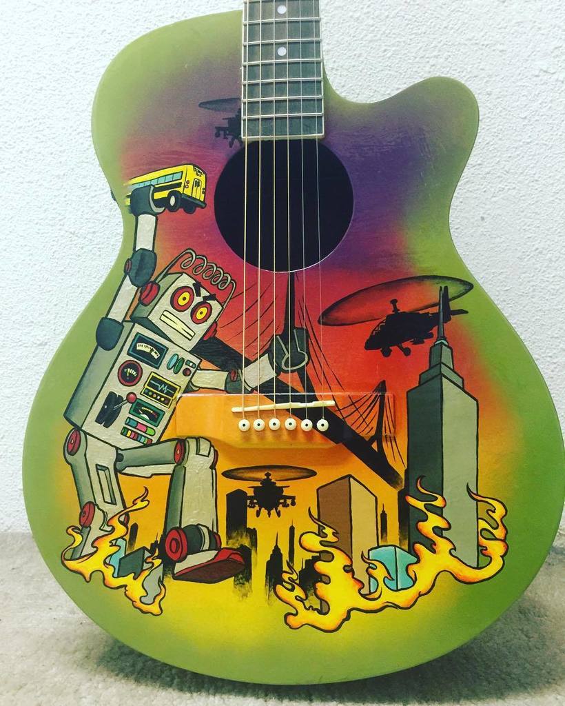 Otherbots's tweet photo. "The A.I. massacre of 2036" acrylic paint on an Epiphone EJ200 #acrylic #paintings #jimmynationart #epiphone #epiphโฆ https://t.co/6Cyi0yvg89