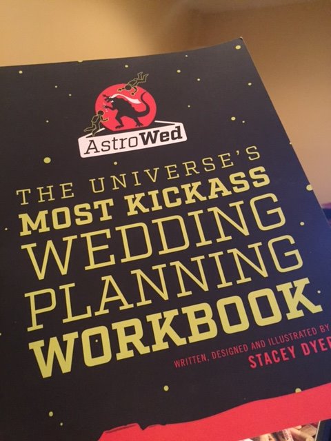 Just got our copy of <a href="/AstroWedHQ/">AstroWed</a>, space-themed wedding workbook hot off the presses. Rocket ships inside! SO AMAZING
