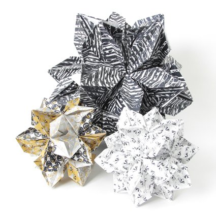 #origami #flowerballs #handprinted #screenprinted #papermanipulation #printmaking #handfolded #paper #pattern #deco