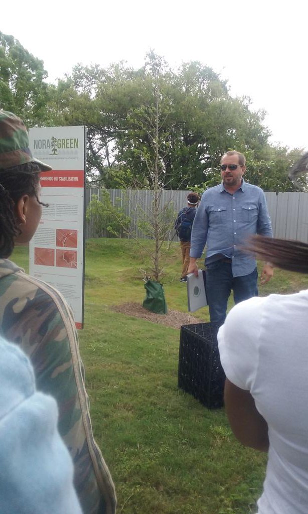 GoPropeller's tweet photo. Our ventures' impact in action: @greenmandan gives our team a tour of the N.Claiborne #raingarden! #propelchange https://t.co/IMEmlvNBcB