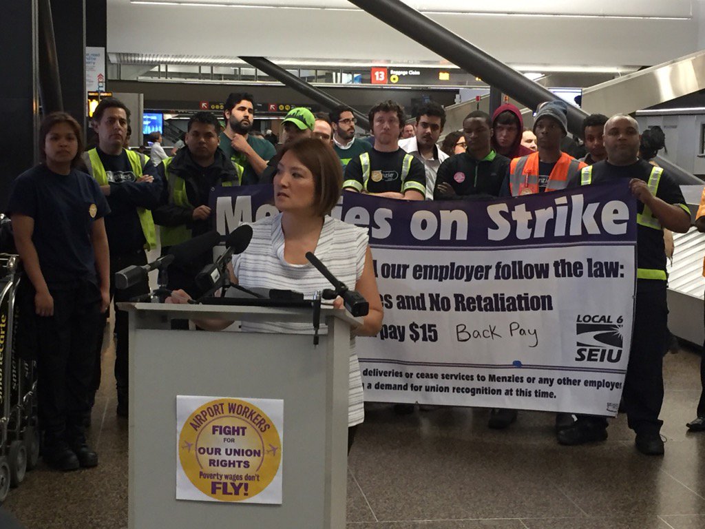 Airport workers across US strike for better pay, benefits