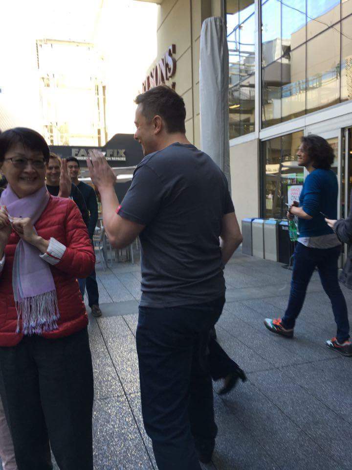 Teslarati's tweet photo. High-five from Elon Musk himself at Century City for the #Model3. Now THAT's a CEO!! https://t.co/cwE38kmxp8