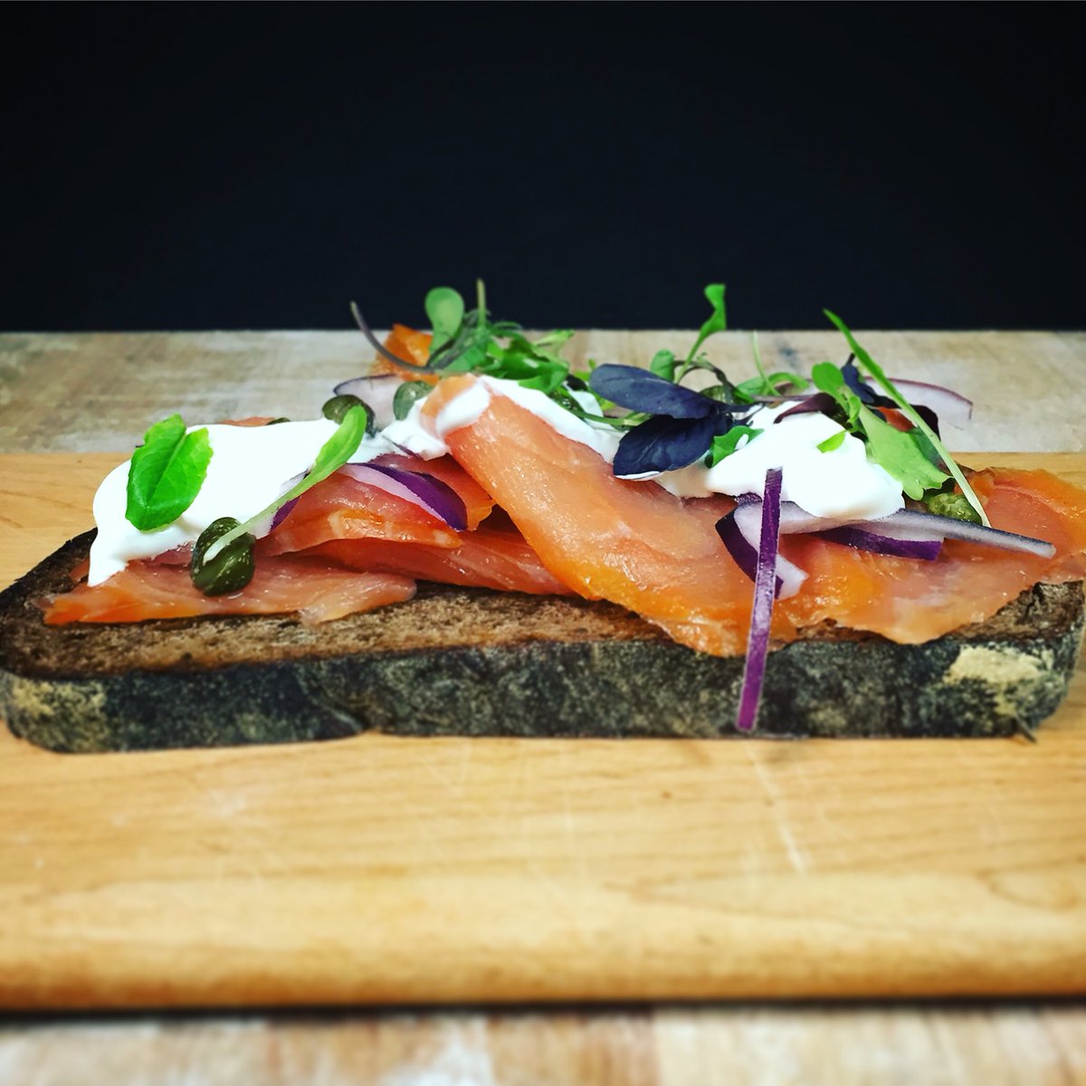rossbread's tweet photo. Smoked salmon on freshly baked Ross pumpernickel with creme fraiche, capers + micro-greens. #pumpernickel  #tartine https://t.co/FIlkk3HDJt