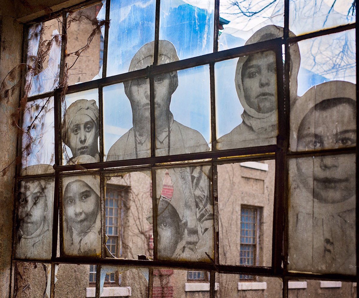 TRatermann's tweet photo. Ellis Island:  "Unframed Series" display in the old abandoned buildings- amazing! https://t.co/Wm3BZ759Ou