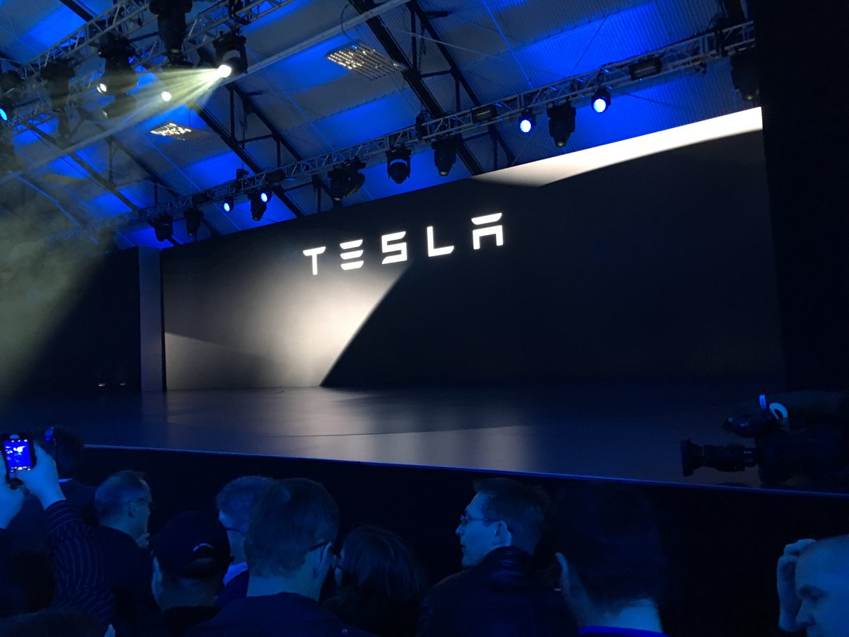 verge's tweet image. The Tesla #Model3 event is about to begin  theverge.com/2016/3/31/1133…
