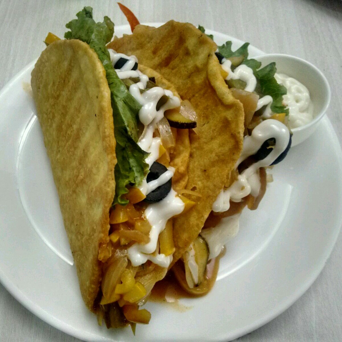 WoozoeApp's tweet photo. How are you celebrating  #nationalcrunchytacoday ? A perfect recommendation on the #woozoeapp from #cafeMammaMia! https://t.co/Od6zCpB4ay