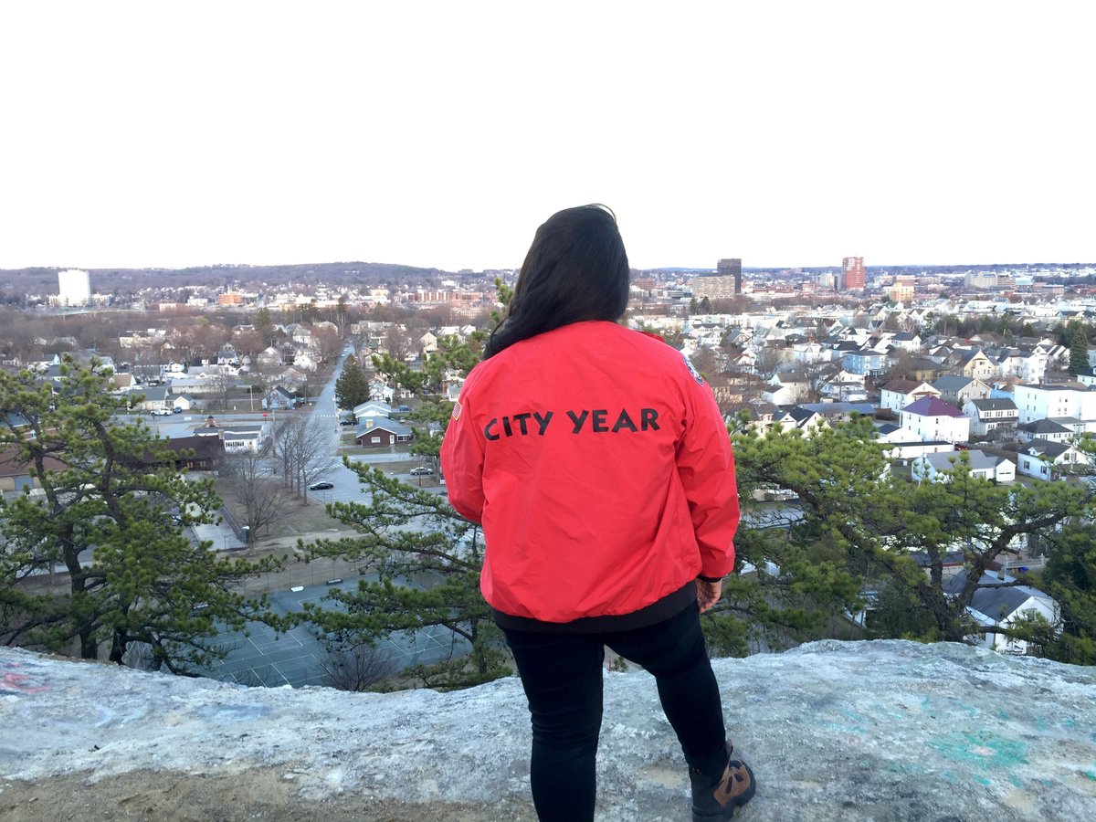 McDonough_CY's tweet photo. One of our Corps member standing above Manchester reflecting on her year of impact #makebetterhappen @CityYearNH https://t.co/dJx5r54avg
