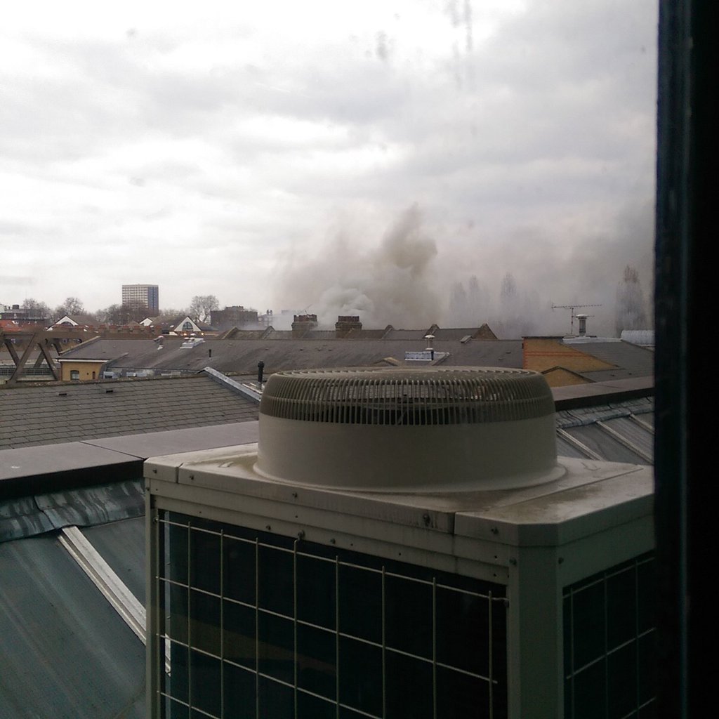 The fire on #BrickLane is affecting a 4 storey office building. 8 fire engines are now at the scene © @inheadkay