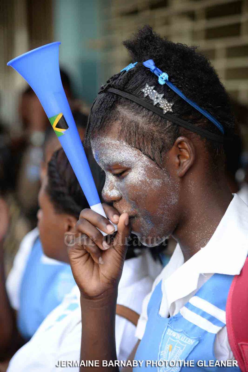 JamaicaGleaner's tweet photo. An Edwin Allen student blows a horn, celebrating her school's Girls #Champs2016 win @ a gathering today #glnrCHAMPS https://t.co/V6RPEWugj7