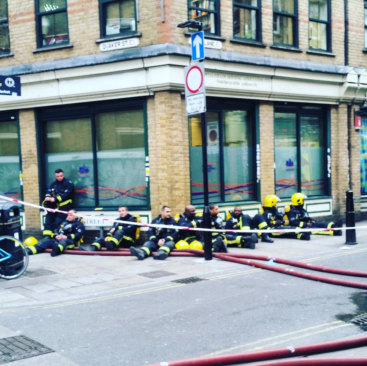 Not often you see this many firemen resting after fighting a blaze - well done guys! #london #bricklane #firemen