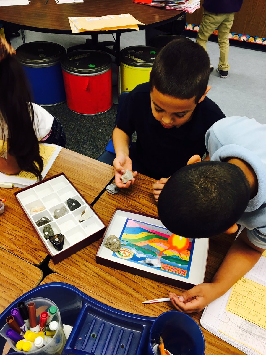 2nd graders making discoveries and journaling their findings about rocks!