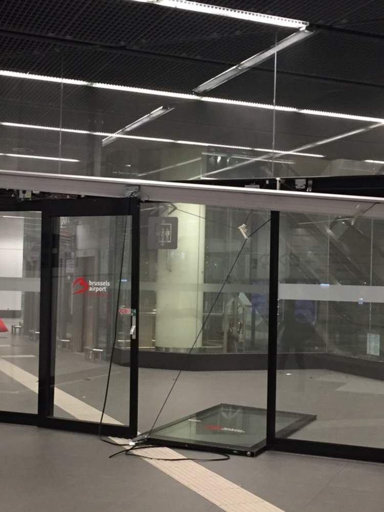 SkyNews's tweet photo. Images have emerged following two loud explosions heard at  Brussels airport https://t.co/5lWcJI8WOP