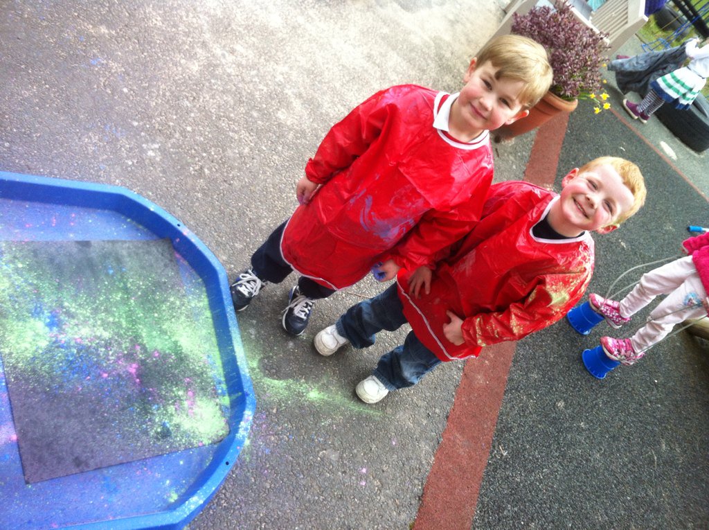 Throwing paint in the nursery to celebrate Holi!