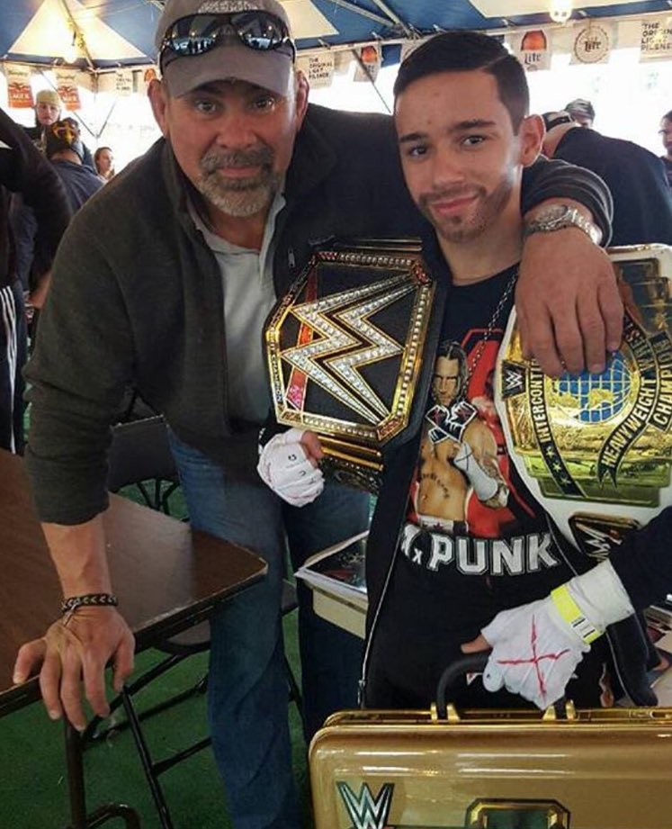 Little_CM_Punk's tweet photo. Little Cm Punk with former @wwe superstar #rickstiner #martincountyfair https://t.co/4Jmno4eTh9