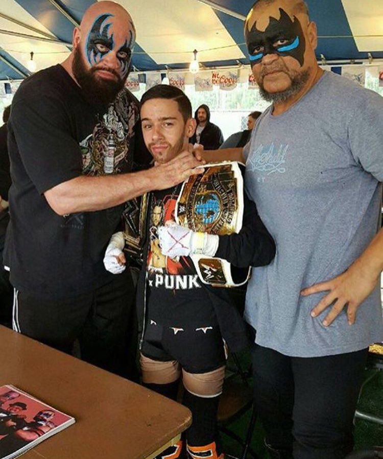 Little_CM_Punk's tweet photo. Little Cm Punk with former @wwe Tag team #thepowersofpain #martincountyfair https://t.co/ohWywkrdzG