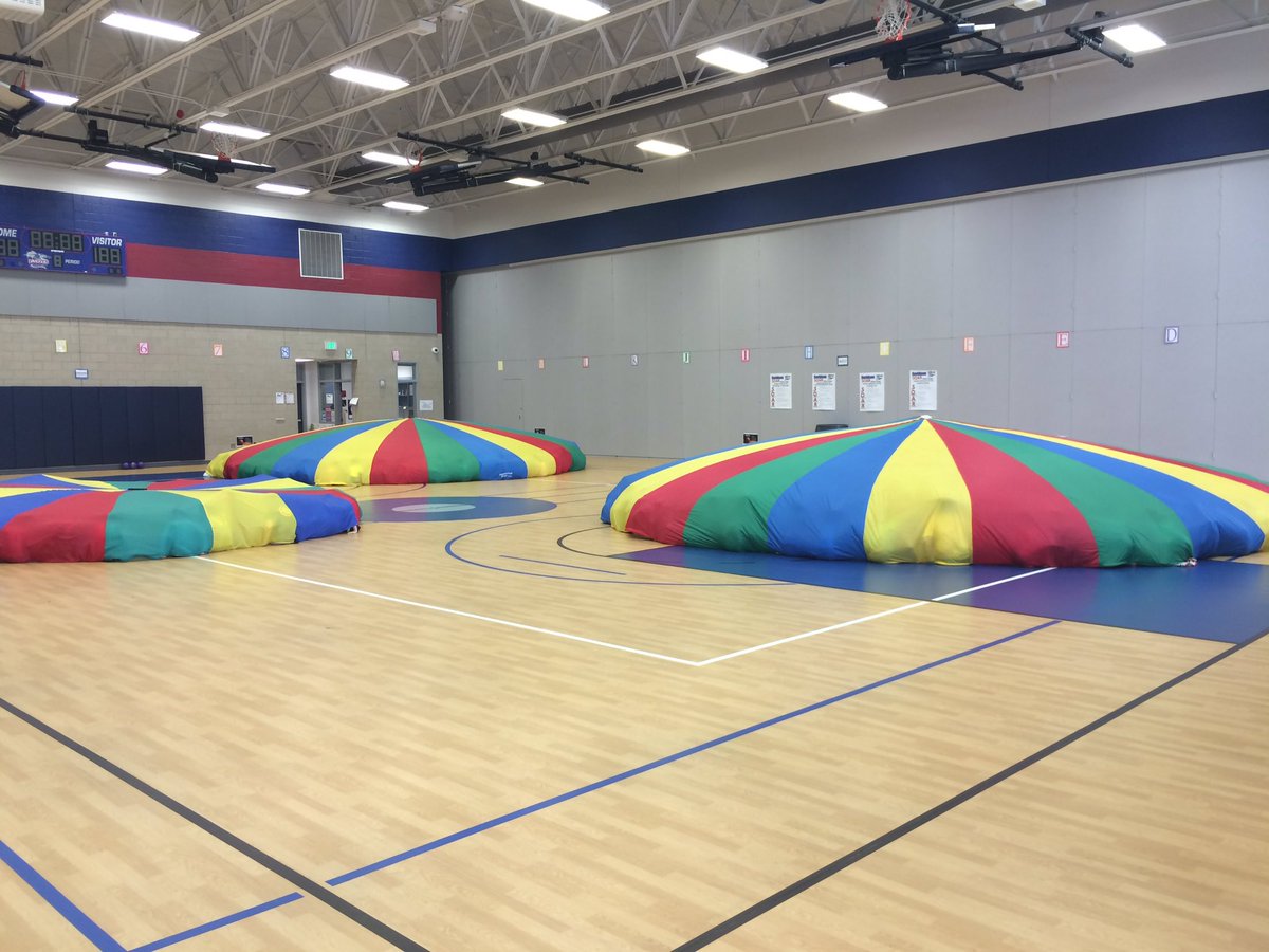 CoachWhitmanKDE's tweet photo. Where are the kindergarteners? They're hiding in the "clubhouse"! Having parachute fun in PE.  #kdepride https://t.co/INz9rqp2qi