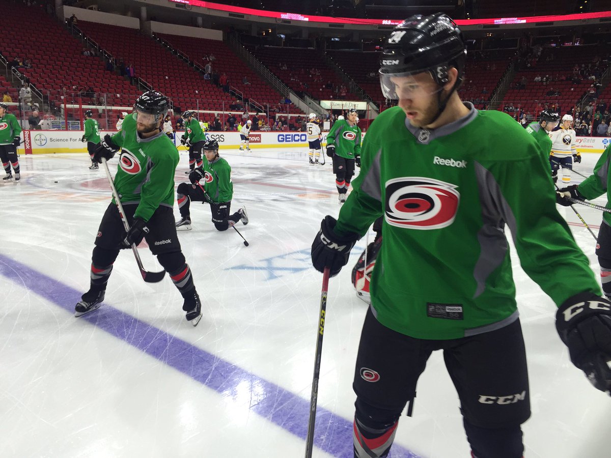 Canes's tweet photo. The #Canes are warming up in green for #GoGreenNight presented by @Bayer4CropsUS. #BUFvsCAR https://t.co/3E1YA3QBAo