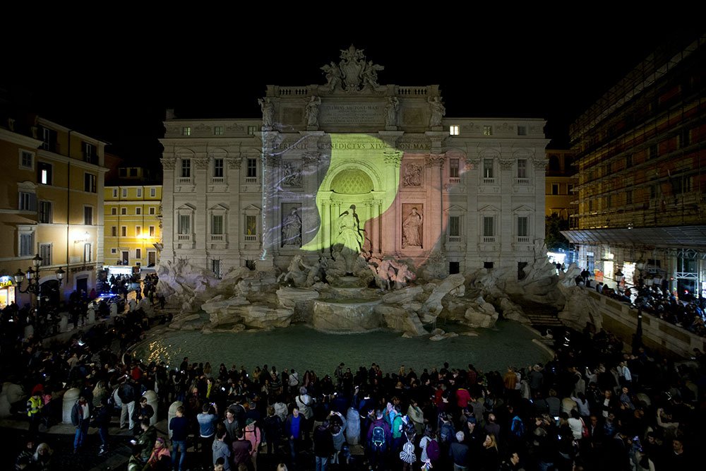 smh's tweet photo. World landmarks illuminated in colours of Belgian flag in a show of solidarity following #BrusselsAttacks (Pics: AP) https://t.co/nRQyaylGDc