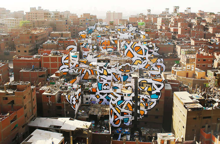 Daniel_Yiu's tweet photo. Une anamorphose gigantesque sur 50 bâtiments du Caire https://t.co/KCTXqX7Qov via @Etapes #elseed #streetart https://t.co/6O0a6kF1kT
