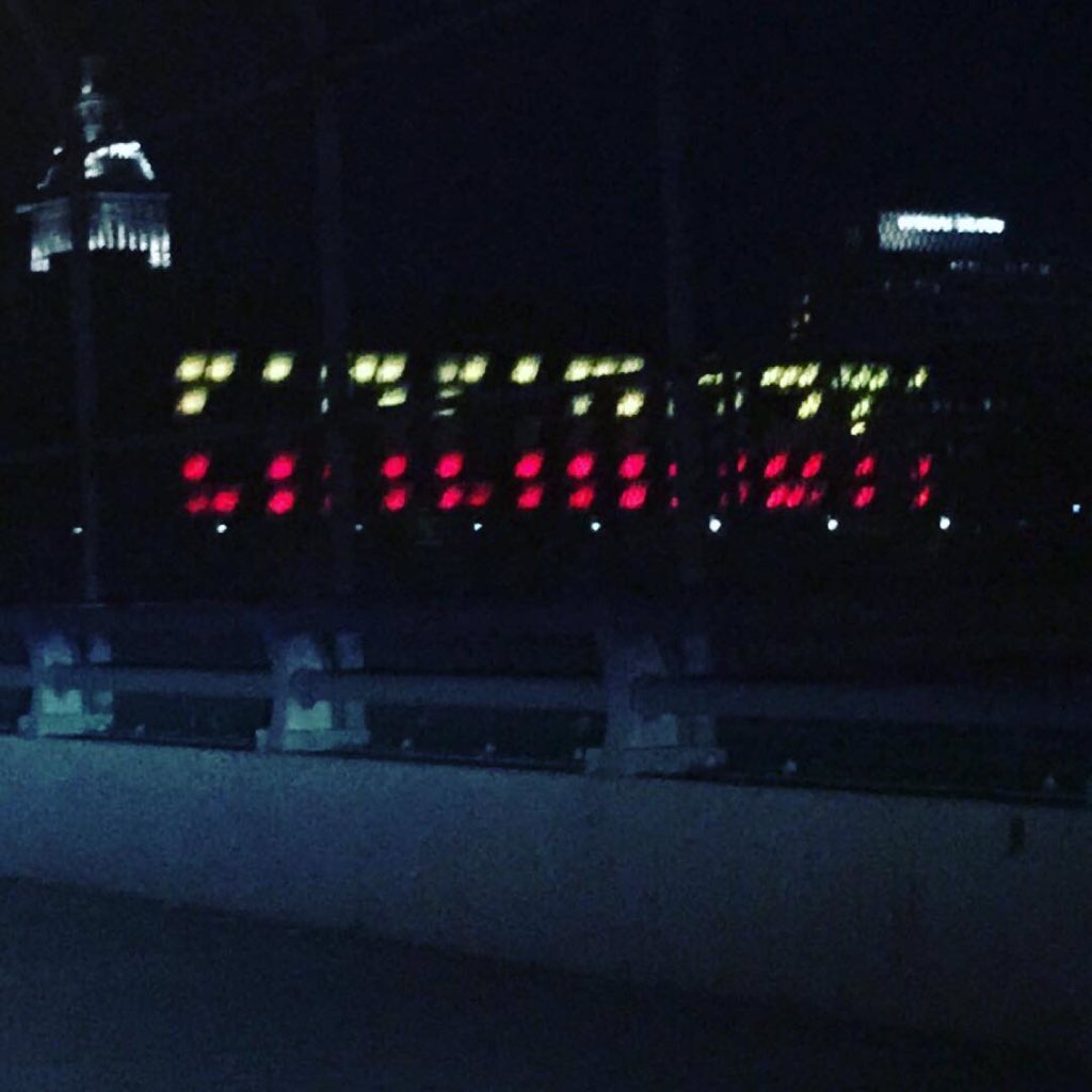 CityOfCincy's tweet photo. The Cincinnati sign at Duke Energy Center is lit up in the colors of Belgium's flag. #WeStandWithBrussels https://t.co/d00YvCUTuK