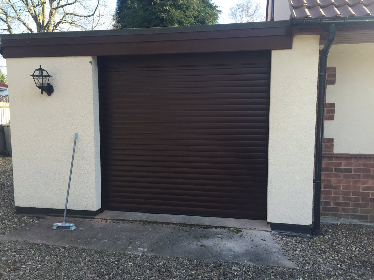 YLGDMLtd's tweet photo. Old up and over door out and new complete rosewood roller door fitted. https://t.co/XMR0Wyipqa
