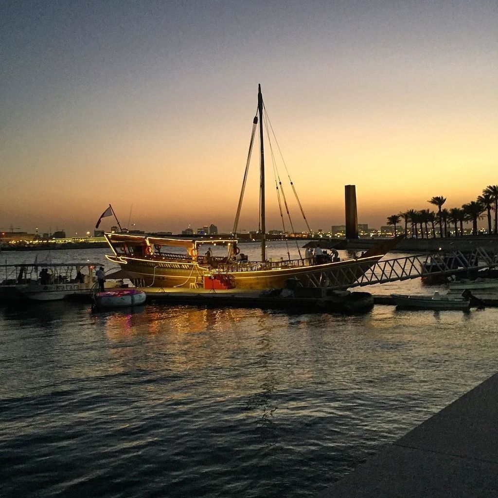 KarenBurnsBooth's tweet photo. Doha waterfront and Dhow at dusk #dhow #dhowboat #dhowdining #Doha #Qatar #QIFF2016 #Qatar… https://t.co/wpk28vlfUI https://t.co/9CFVaVMfZi