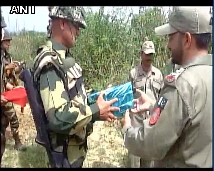 ANI's tweet image. Samba(J&amp;amp;K): BSF and Pakistan Rangers exchange sweets at the border #Holi