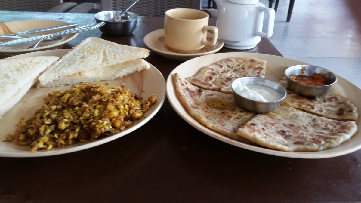 fowsky01's tweet image. Egg barjee with aloo paratha with curd and pickle #spicybreakfast washed down with a pot of milky coffee £1.50