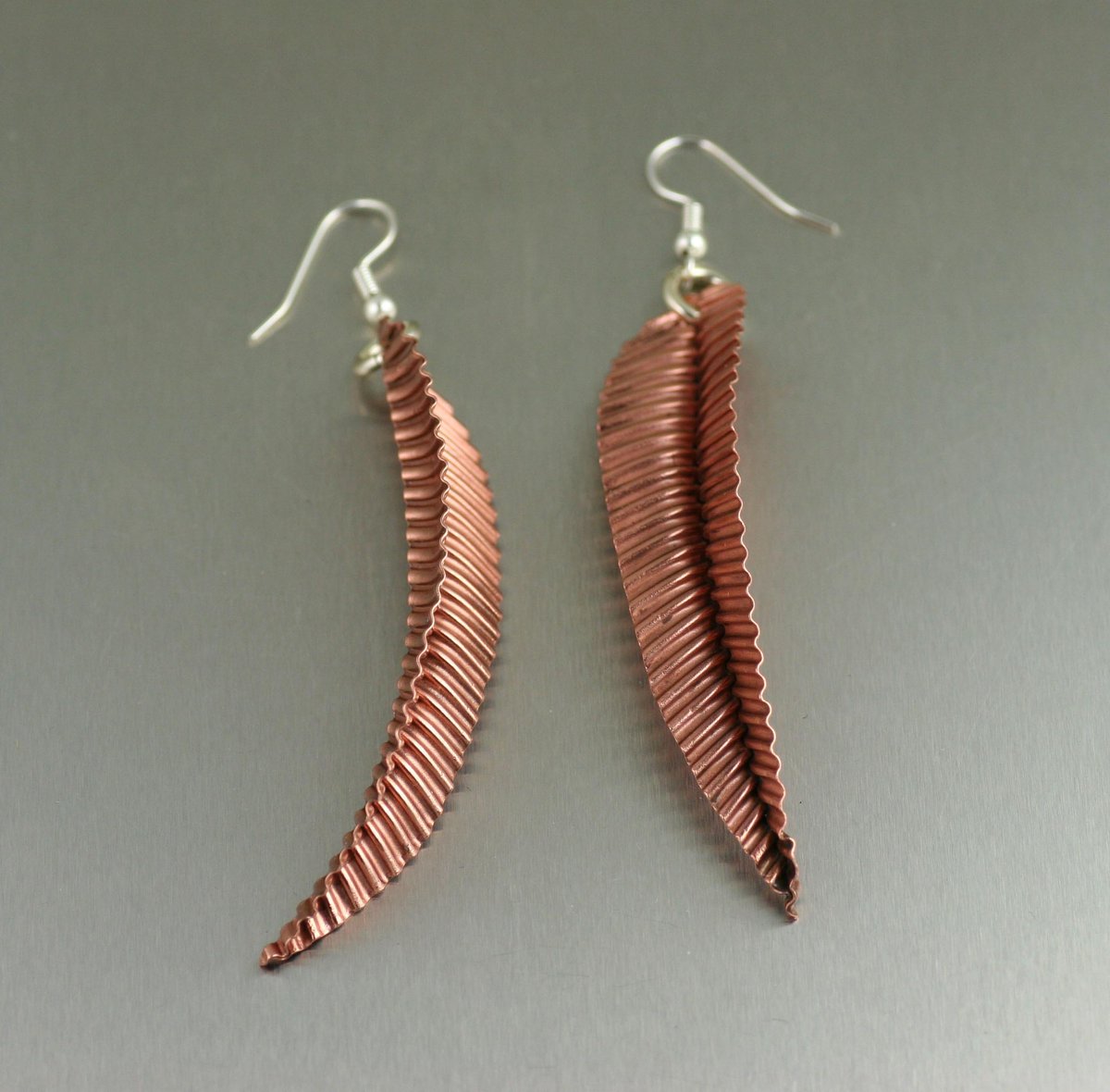 7thAnniversary's tweet photo. Fashionable Fold Formed Copper Leaf Earrings Highlighted by #ILoveCopperJewelry #CopperAnni https://t.co/ArXNZ5pQMl https://t.co/m5Ze9iD4wW