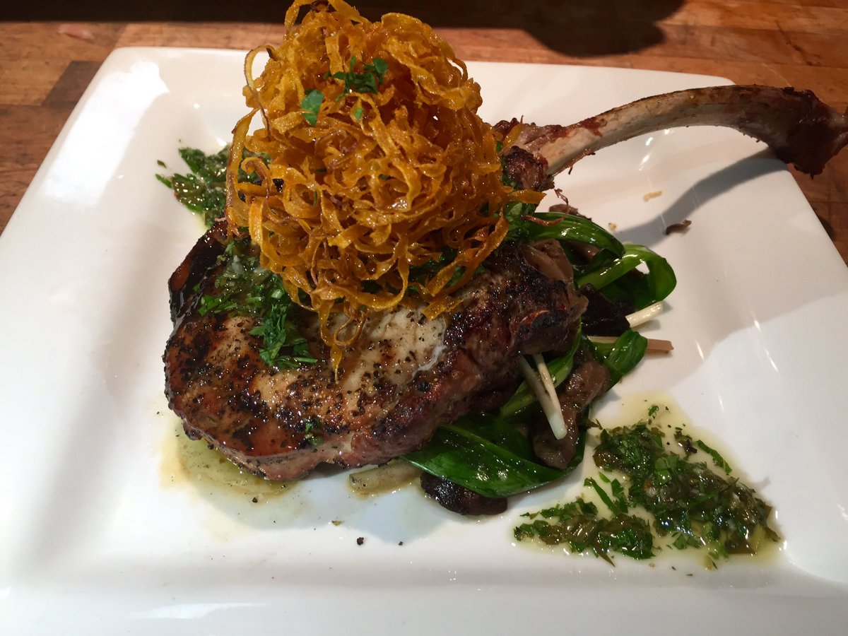 10oz Tomahawk Pork Chop, sautéed mushrooms, ramps, salsa verde, sweet potato hay #lkhh #libertykitchen #houheights