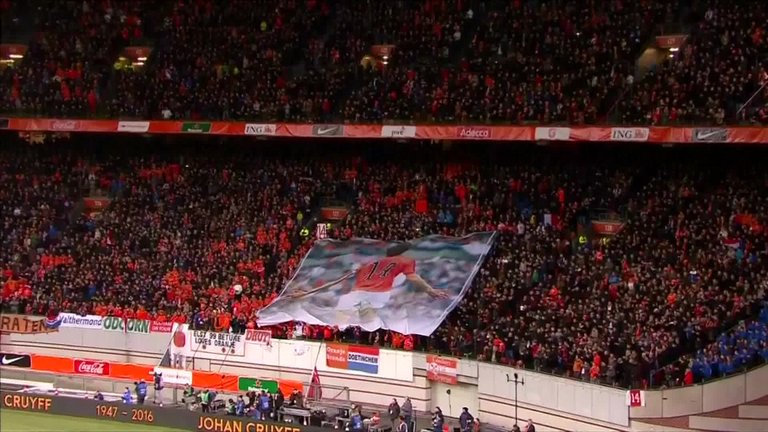 SkySportsPL's tweet photo. Netherlands fans pay moving tribute to Johan Cruyff in 14th minute versus France last night: https://t.co/zwnnux3gDT https://t.co/TnwEhIrypd