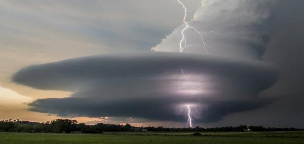RJSzczerba's tweet photo. WOW! - Lightning strikes through the eye of the storm (by Vanessa Neufeld) https://t.co/rlTvwEioma