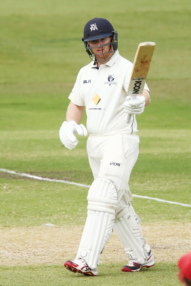 VicStateCricket's tweet photo. Trav Dean raises his bat to his teammates after reaching his fifty.

VIC 2-122. https://t.co/JrBHfnJ3fp