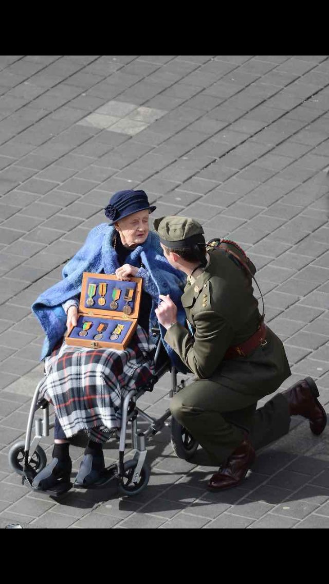 Here's another photo of the Army Press Officer that was on his phone doing his job today. This one hasn't gone viral
