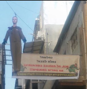 ops_pal's tweet photo. Orthodox area mea shearim showing their anger by hanging the killer soldier doll alongside #Palestine #flag #purim https://t.co/41AMc9c7qY