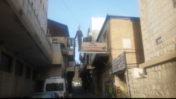 ops_pal's tweet photo. Orthodox area mea shearim showing their anger by hanging the killer soldier doll alongside #Palestine #flag #purim https://t.co/41AMc9c7qY
