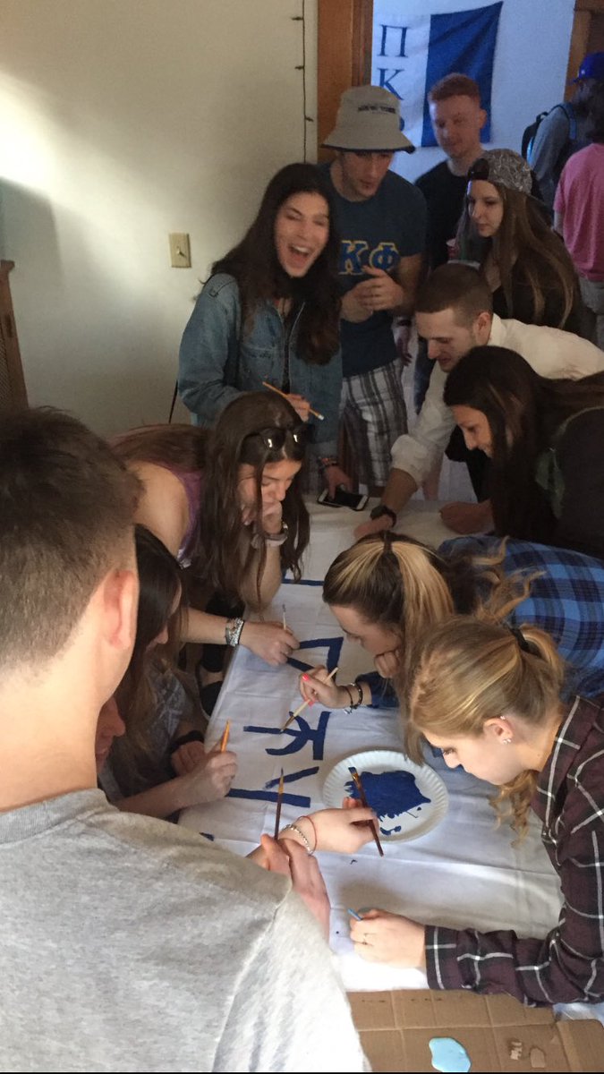 Sharing pizza and wings with <a href="/dphieub/">UB DPhiE</a> while painting our banner for this week's #SpreadTheWordToEndTheWord event