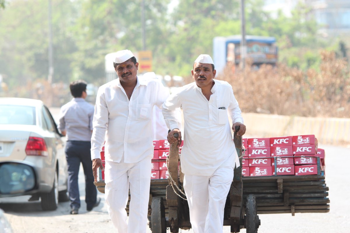 TaariniNB's tweet photo. So cool, @KFC_India! The dabbawalas of #Mumbai surprised some people with their new 5-in-1 Meal Box. :) #KFCBoxwalas https://t.co/xA7uHwjfLW