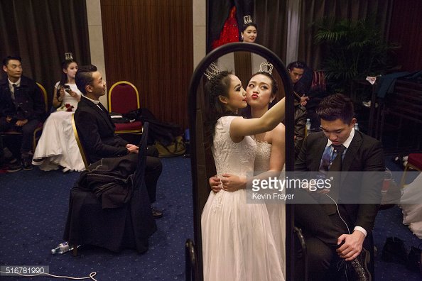 GettyImages's tweet photo. Debutantes at the Vienna Ball in the Kempinski Hotel in Beijing. Feature by @kevinfrayer https://t.co/U8TLHL8Gxu https://t.co/5Y1jQHeI00