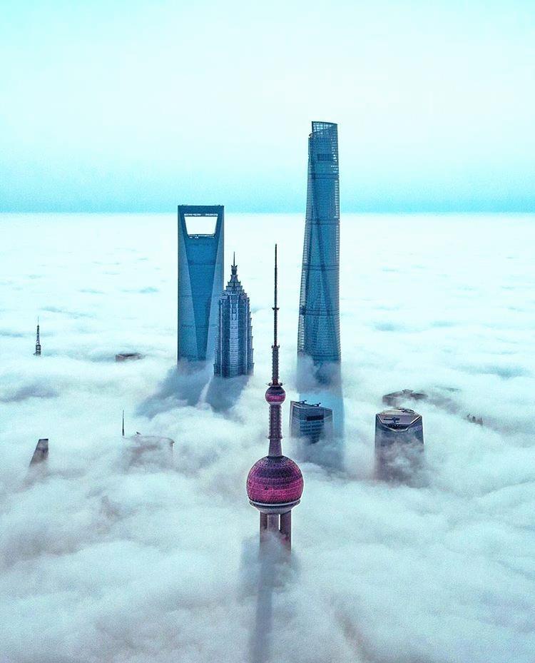 Dronepedia's tweet photo. Gorgeous drone shot of fog rolling through Shanghai, China by S. Huang. -  #droneventures #dronevideos #dronephotos https://t.co/I7FIn15C43