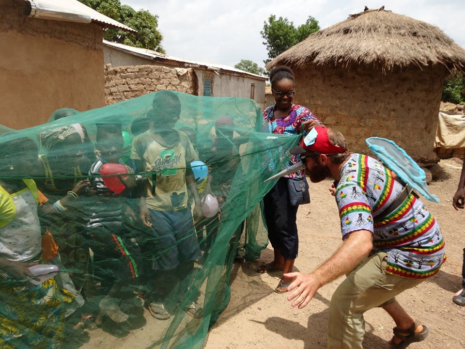 PeaceCorps's tweet photo. Guinea Volunteers make learning about mosquito nets fun. Kids hide from a balloon-popping mosquito under their nets. https://t.co/pwcI6nQzPQ
