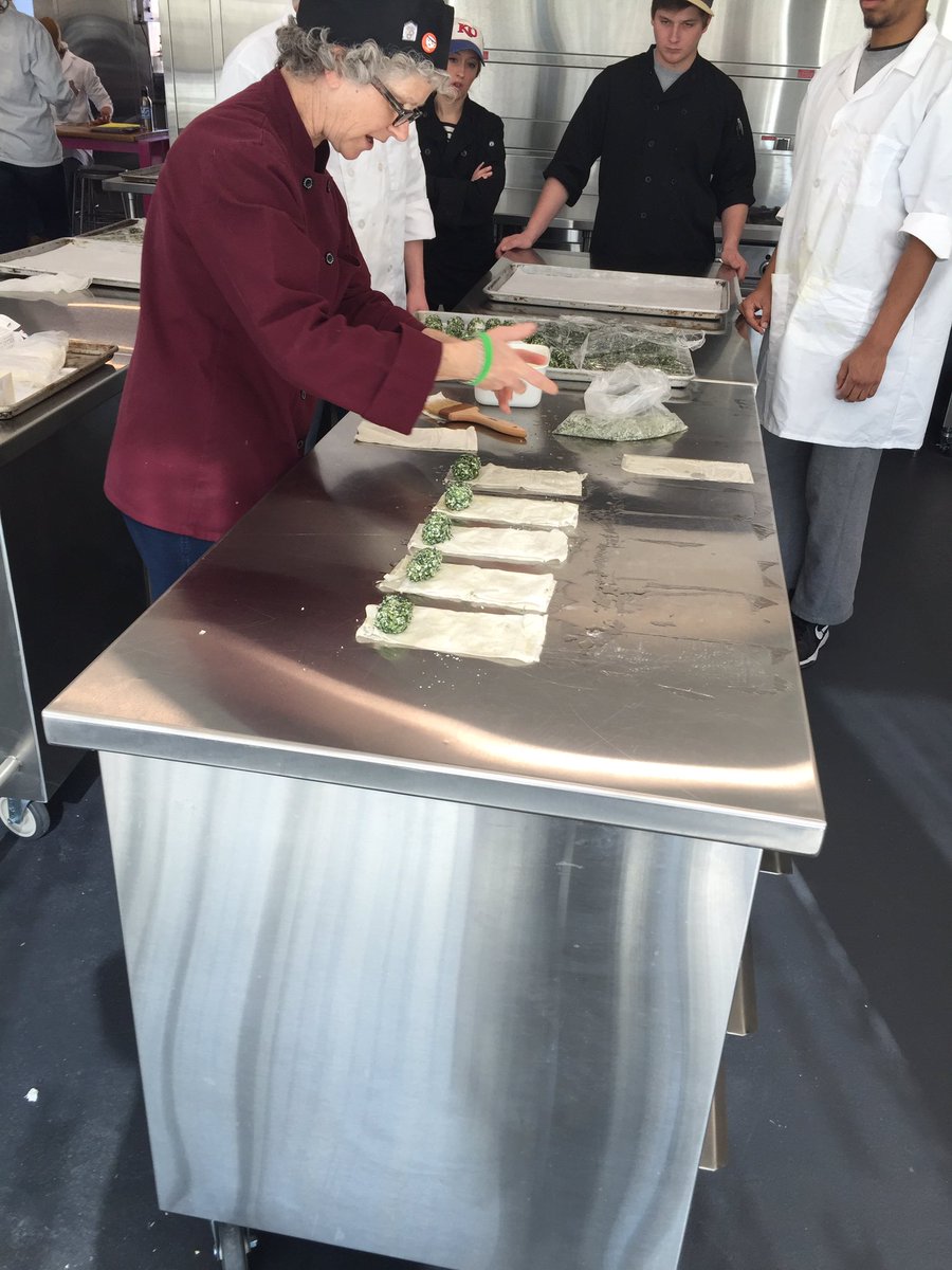 Abbe putting the secret ingredient into our delicious Moroccan rolls. (Hint: it's love) come in and try some!