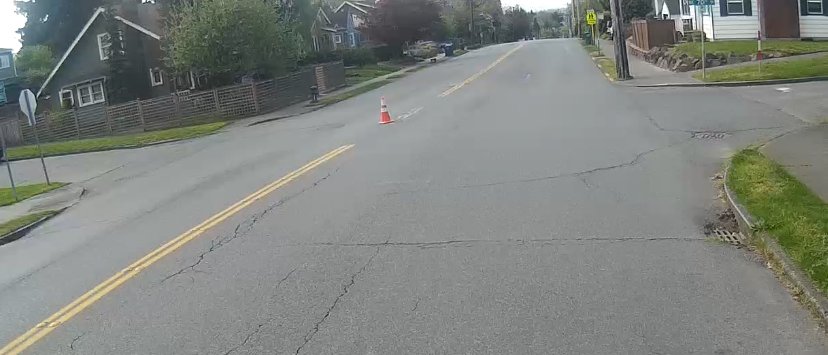 SEA_DOTr's tweet photo. We approve of this cone placement. Slowing down drivers and helping people cross 15th Ave.  #TacticalUrbanism https://t.co/Bpxn8sU64K