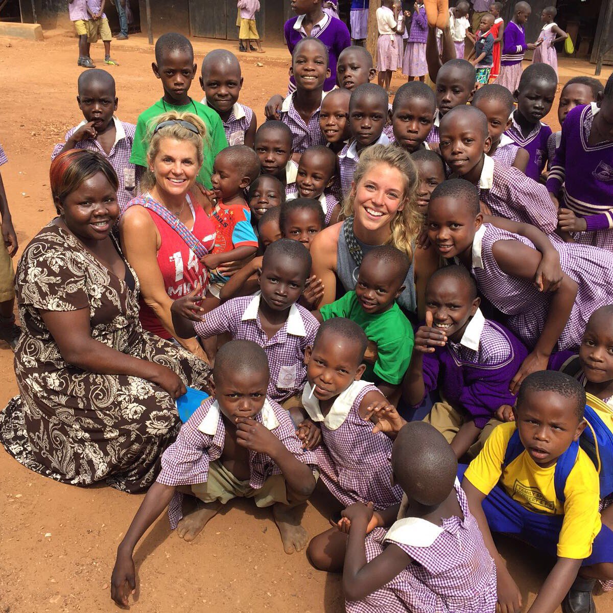 loveoneint's tweet photo. @laur_akins @suzannemayernic Doing what they do best & loving on some children. β€οΈ #love1 #lovemany #147Uganda https://t.co/7TKFBcetJg