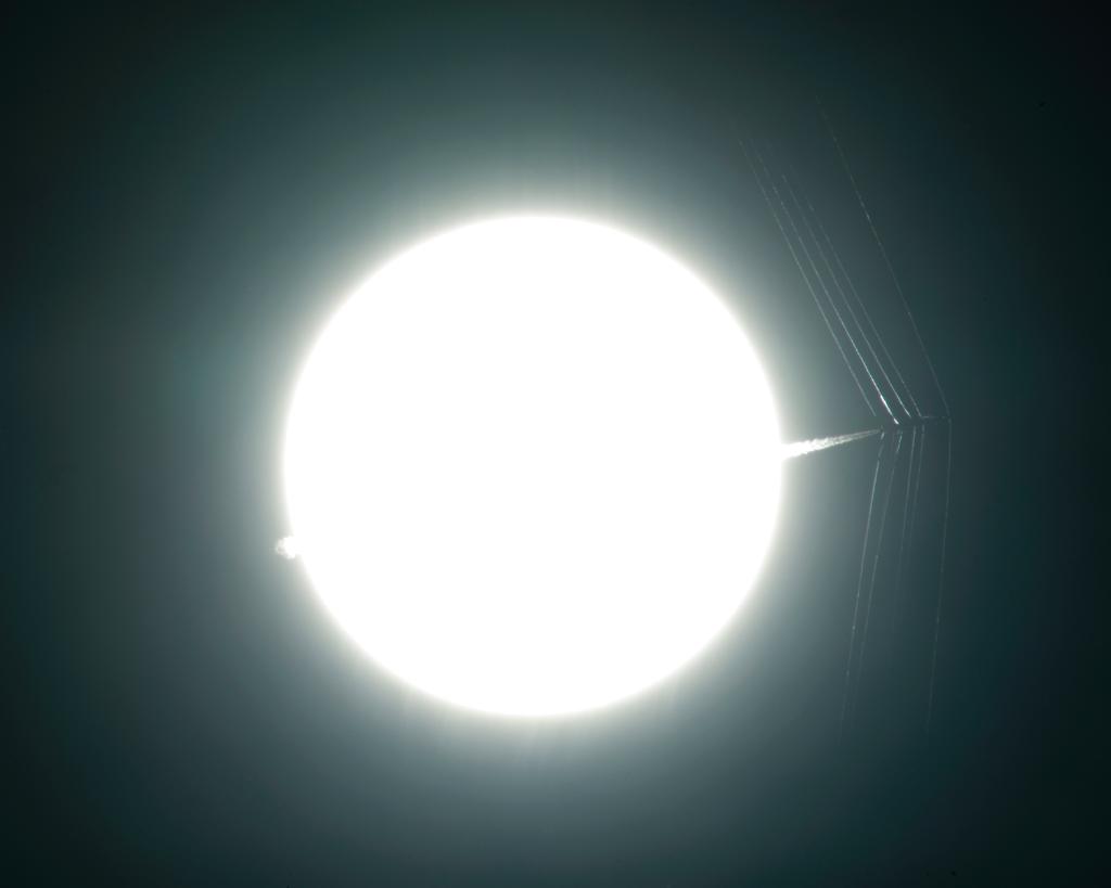 NASA's tweet photo. T-38C passes in front of sun at a supersonic speed, creating shockwaves caught for research: https://t.co/yy0T2HvsZj https://t.co/fTUCYyze9W