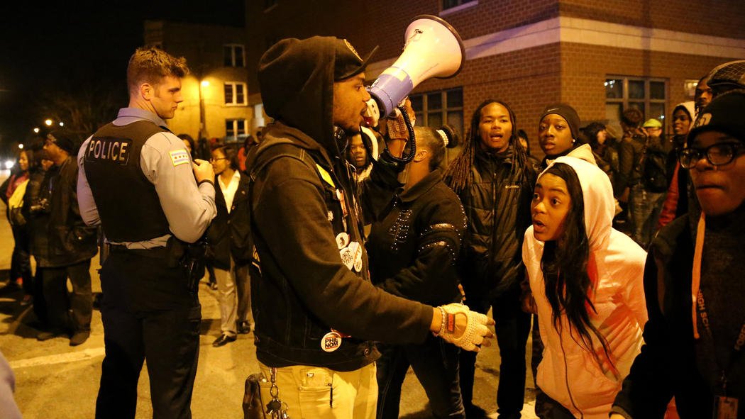 chicagotribune's tweet photo. More than 100 people hold vigil at scene where 16-year-old boy was fatally shot by police https://t.co/IIKYDP8cUb https://t.co/t5CEqDwAAF