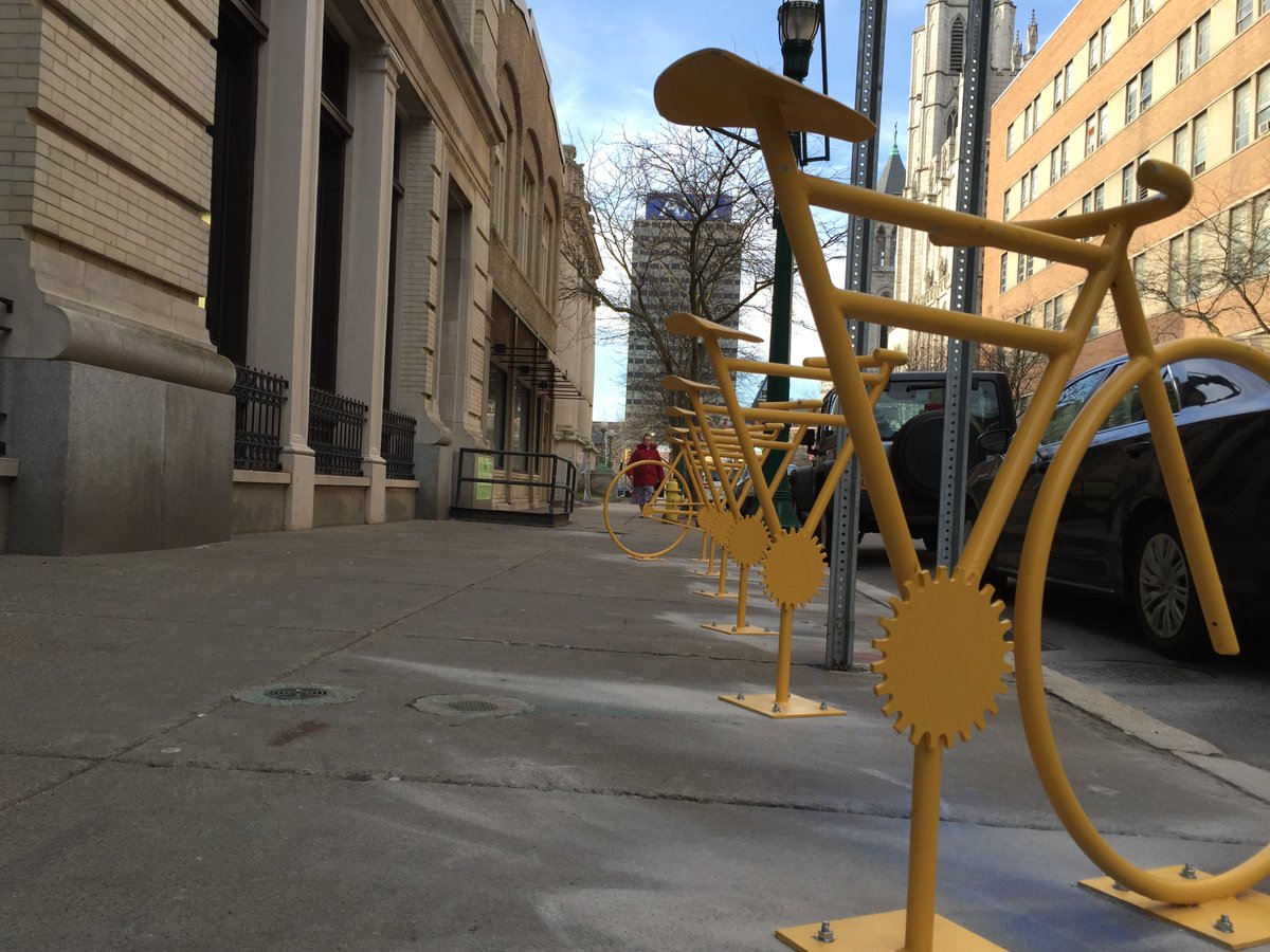 OnondagaHisAssn's tweet photo. Our Yellow Fellow inspired bike rack was installed today! We don't recommend using it like this though. #Syracuse https://t.co/tWsHEY1fCt